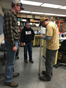 (left) Jacob Lemon, PATU Eastern Shale Gas Monitoring Coordinator, teaching workshop attendee's how to use a Secchi Tube to measure water turbidity.